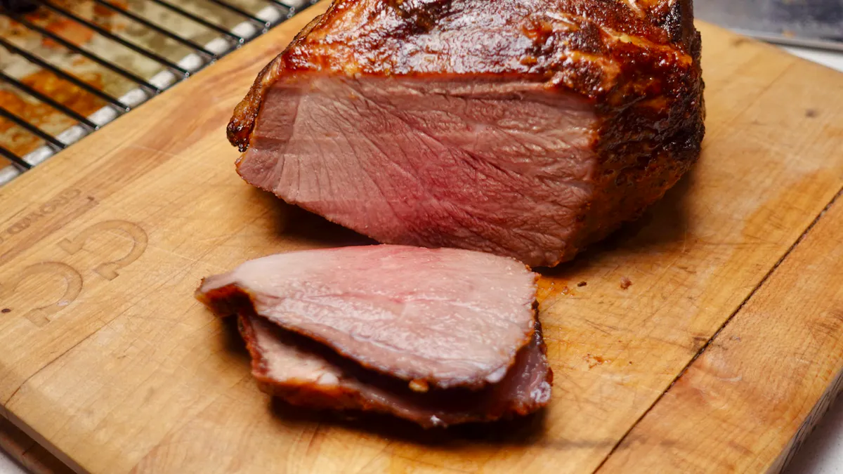 A roasted pork butt with a browned crust, two slices resting on a wooden cutting board