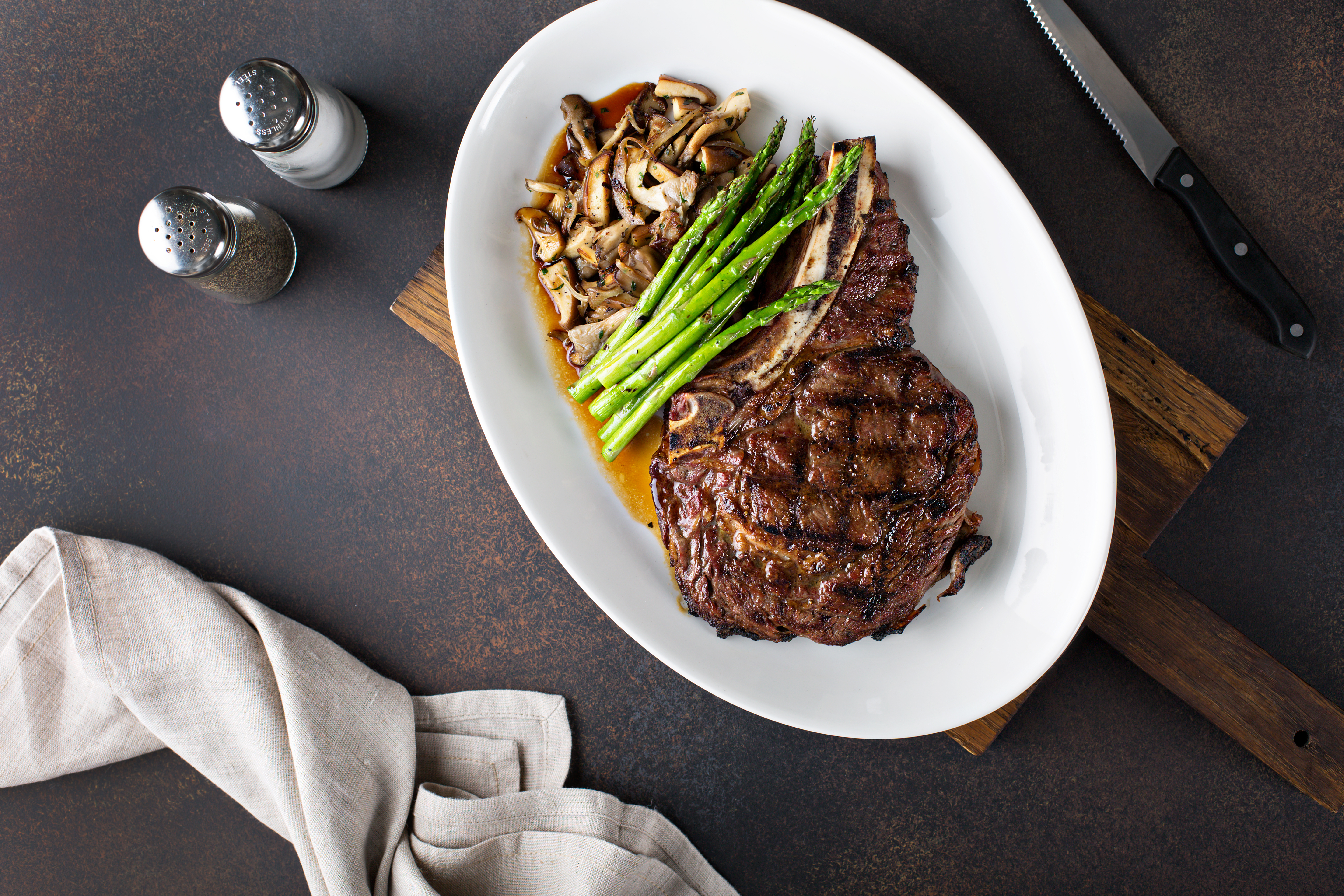 Grilled Rib Eye with Lemon Scented Asparagus, Parmesan Truffle and Potato Gnocchi