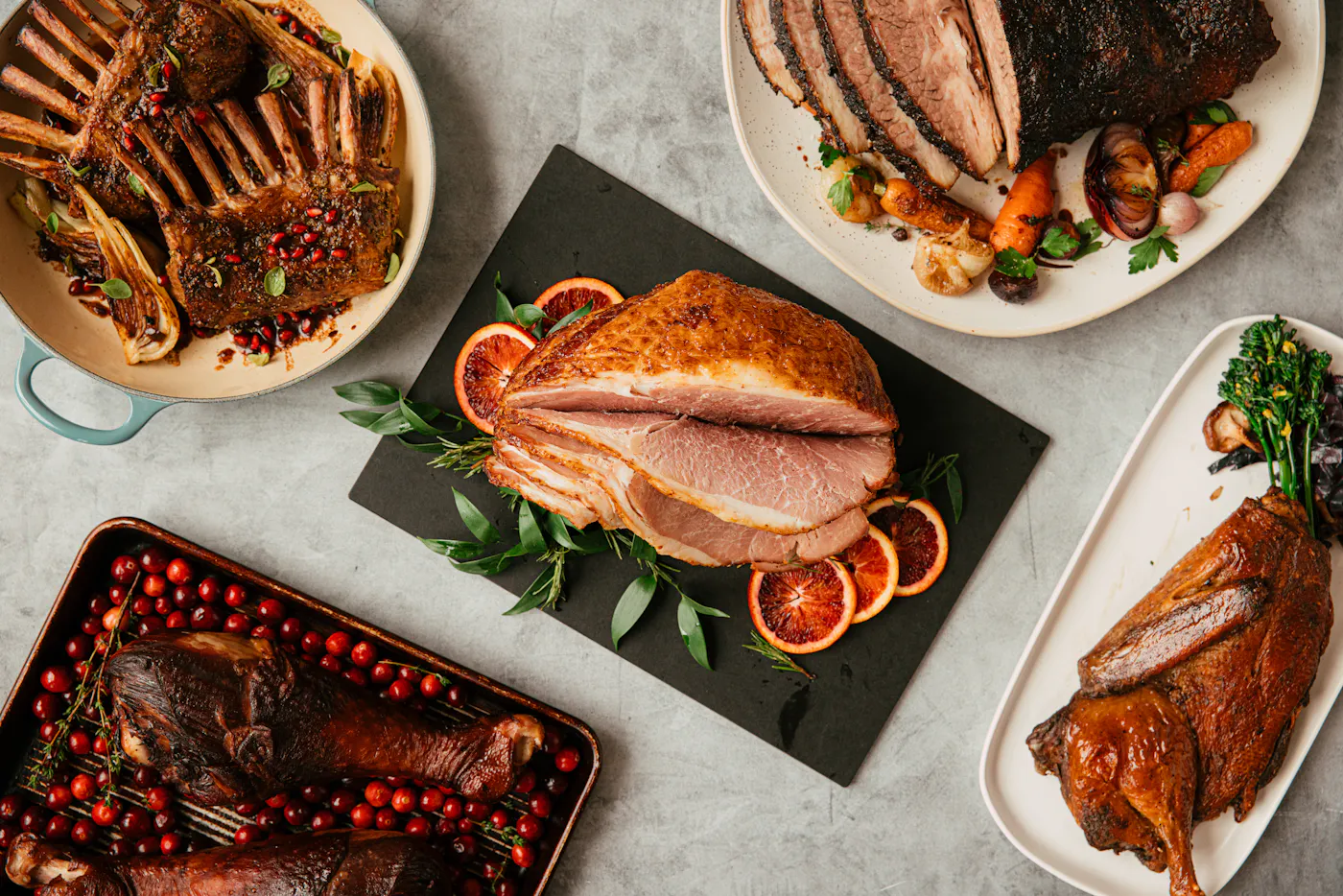 Ham, lamb, duck, turkey and brisket on a holiday table
