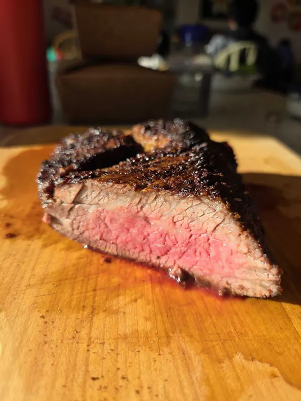 A sliced tri-tip showing an even pink center